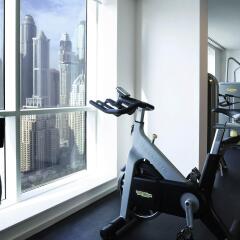 Pullman Dubai Jumeirah Lakes Towers - Hotel and Residence фитнесс-зал фото 2