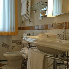 Villa Tolomei Hotel & Resort ванная фото 2