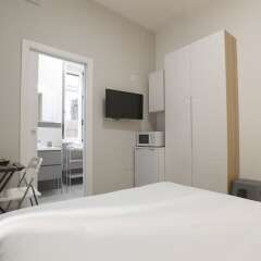 Апартаменты Santi Quattro Apartment & Rooms - Colosseo комната для гостей фото 3
