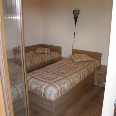 Отель Rodopi Houses Болгария, Чепеларе - отзывы, цены и фото номеров - забронировать отель Rodopi Houses онлайн комната для гостей