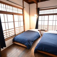Taketa station hostel cue Минамиогуни комната для гостей фото 4
