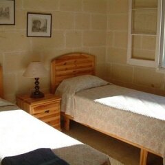 Отель Odysseus Court Gozo Мальта, Мунксар - отзывы, цены и фото номеров - забронировать отель Odysseus Court Gozo онлайн комната для гостей