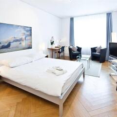 Апартаменты Jenatsch Apartments Цюрих комната для гостей фото 4