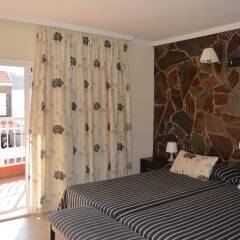 Отель La Aldea Suites комната для гостей