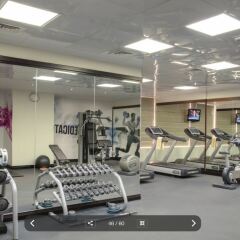 Отель Jumeira Rotana фитнесс-зал фото 2