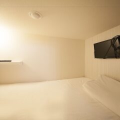 Отель Capsule and Sauna Oriental Япония, Токио - отзывы, цены и фото номеров - забронировать отель Capsule and Sauna Oriental онлайн комната для гостей фото 3