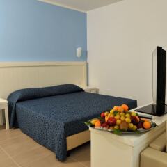 Toccacielo Hotel Village Нова-Сири в номере фото 2