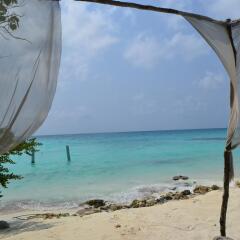 Отель Maison Tiare' Maldives Thulusdhoo Остров Гасфинолу пляж