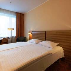 Отель AC Hotel by Marriott Riga Латвия, Рига - 5 отзывов об отеле, цены и фото номеров - забронировать отель AC Hotel by Marriott Riga онлайн комната для гостей фото 4