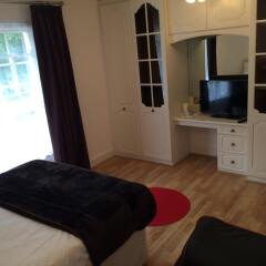 Апартаменты Wellington Road Apartments комната для гостей