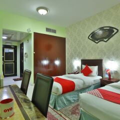 OYO 261 Remas Hotel Apartment Дубай комната для гостей фото 5