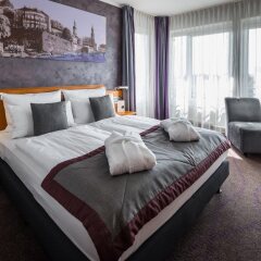 Отель Ramada by Wyndham Dresden Германия, Дрезден - 1 отзыв об отеле, цены и фото номеров - забронировать отель Ramada by Wyndham Dresden онлайн комната для гостей
