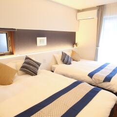 Apartment Hotel Tenjin Tumugu Фукуока комната для гостей фото 3