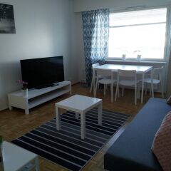 Апартаменты Kotimaailma Apartments Joensuu Йоенсуу комната для гостей фото 2