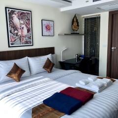 Апартаменты Luxury Apartments in Grand Avenue Паттайя комната для гостей