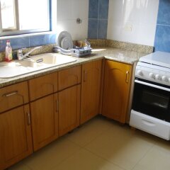 Апартаменты Calabash Green Executive Apartments Тема в номере фото 2