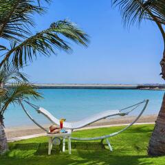 Al Raha Beach Hotel Villas пляж фото 2