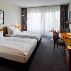 Отель Ramada by Wyndham Dresden Германия, Дрезден - 1 отзыв об отеле, цены и фото номеров - забронировать отель Ramada by Wyndham Dresden онлайн комната для гостей фото 2