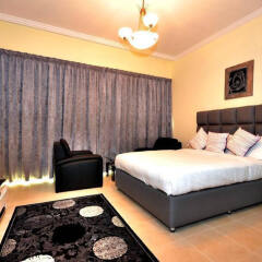 Апартаменты Dubai Stay - Burj Al Nujoom Downtown Holiday Apartment комната для гостей фото 2