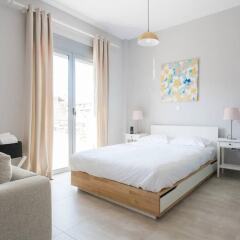Апартаменты Omnia Pagrati Apartments комната для гостей фото 2