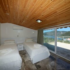 Отель Villa Mercan 1 by Akdenizvillam Калкан комната для гостей фото 5