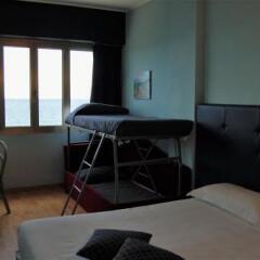 Hotel Le Rocce Del Capo Оспедалетти в номере