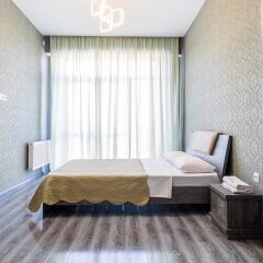 Апартаменты Apartment on Saakadze Square Тбилиси комната для гостей фото 4