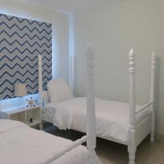 Отель Beach Front Luxury Apartment - BlueBeach Доминикана, Пунта Кана - отзывы, цены и фото номеров - забронировать отель Beach Front Luxury Apartment - BlueBeach онлайн комната для гостей фото 4