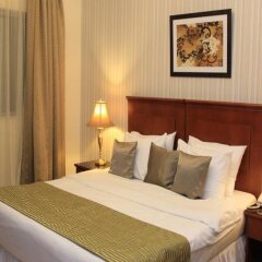 Legacy Hotel Apartments комната для гостей