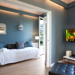 Апартаменты The Boutique Apartments комната для гостей