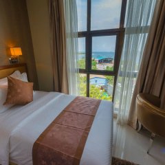 Отель Unima Grand Мальдивы, Атолл Каафу - отзывы, цены и фото номеров - забронировать отель Unima Grand онлайн комната для гостей фото 4