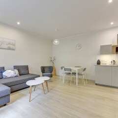 Апартаменты Lion Apartments - Haffnera 19 комната для гостей