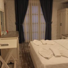 Отель Mina Otel Alacati Чешме сейф в номере