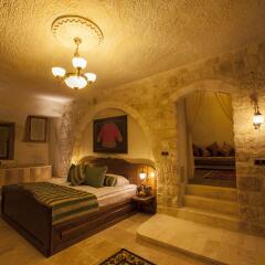 Отель Kayakapi Premium Caves Cappadocia комната для гостей