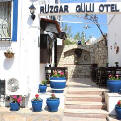 Отель Rüzgargülü Otel Бозджаада бассейн