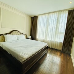 Отель M Suites by S Home Хошимин комната для гостей