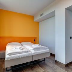Отель MEININGER Hotel Munich Olympiapark Германия, Мюнхен - отзывы, цены и фото номеров - забронировать отель MEININGER Hotel Munich Olympiapark онлайн комната для гостей фото 4