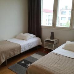 Апартаменты Kotimaailma Apartments Jyväskylä Ювяскюля комната для гостей