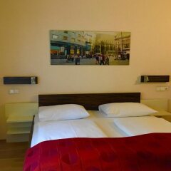 Отель City Rooms сейф в номере