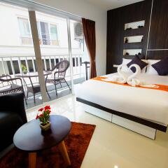 Апартаменты Sunset Apartments Паттайя комната для гостей