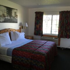 Отель 99 Palms Inn & Suites комната для гостей фото 4