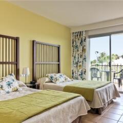 Отель PortAventura Hotel Caribe - Theme Park Tickets Included Испания, Салоу - 6 отзывов об отеле, цены и фото номеров - забронировать отель PortAventura Hotel Caribe - Theme Park Tickets Included онлайн комната для гостей фото 5
