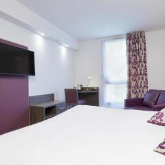 Отель Hôtel Kyriad Saint Quentin en Yvelines - Montigny Франция, Монтиньи ле Бретоне - отзывы, цены и фото номеров - забронировать отель Hôtel Kyriad Saint Quentin en Yvelines - Montigny онлайн удобства в номере