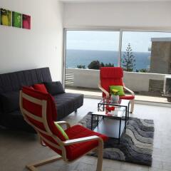 Апартаменты Anemos Apartments комната для гостей