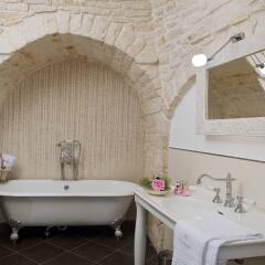 Le Alcove - Luxury Hotel nei Trulli Альберобелло ванная фото 2