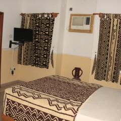 Отель Jacaranda Suites Нигерия, Калабар - отзывы, цены и фото номеров - забронировать отель Jacaranda Suites онлайн удобства в номере