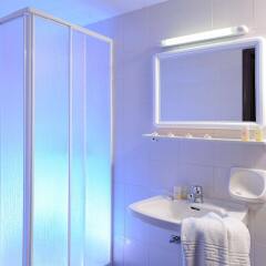 Aegean Sky Hotel & Suites ванная