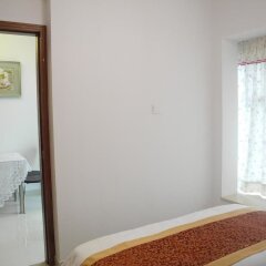 Апартаменты Shenzhen Xin Phoenix Gang Ao 8 Apartment комната для гостей