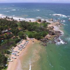 Отель Calamansi Cove Villas by Jetwing пляж