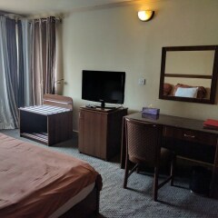 Отель The Camelot Rest House удобства в номере